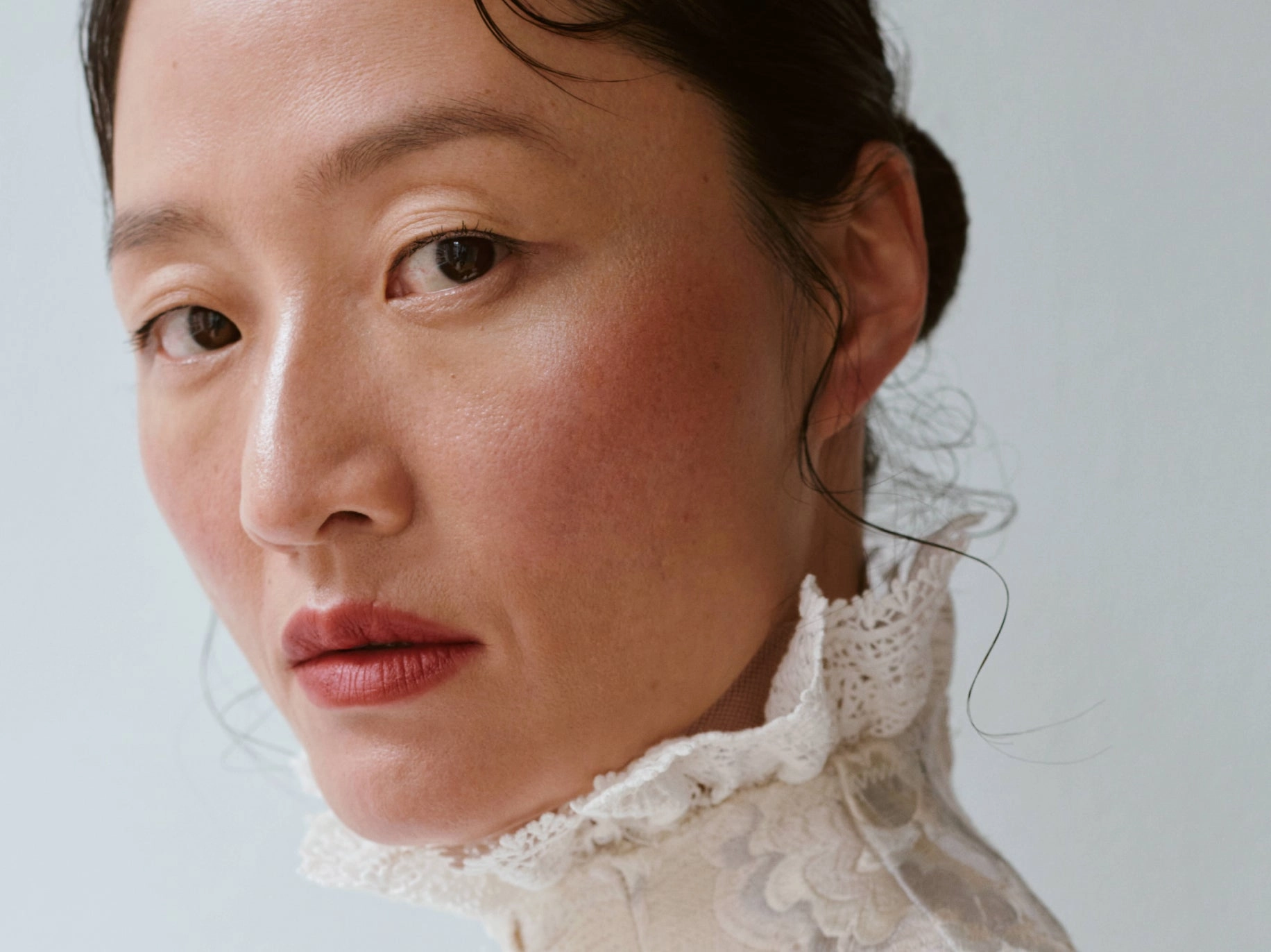 Second portrait of the same woman looking over her shoulder